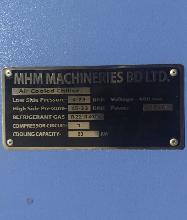 MHM Machineries BD Ltd nameplate fitted to a chiller, listing model, test pressure, compressor circuit and cooling capacity